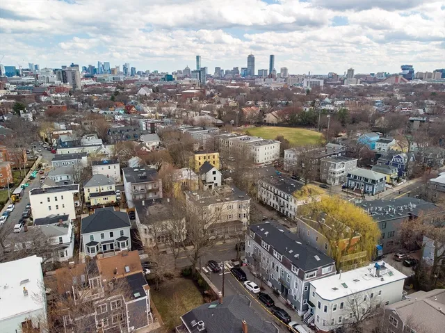 an aerial view of a city with parking space