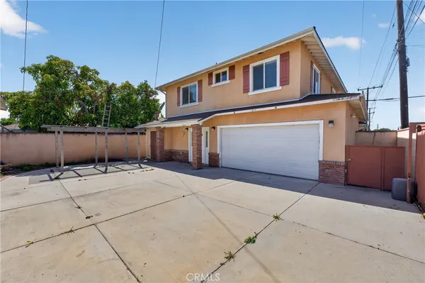 a front view of a house with garage