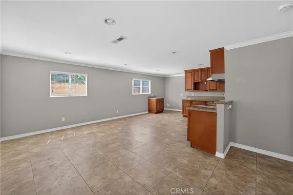 a view of kitchen with furniture and wooden floor