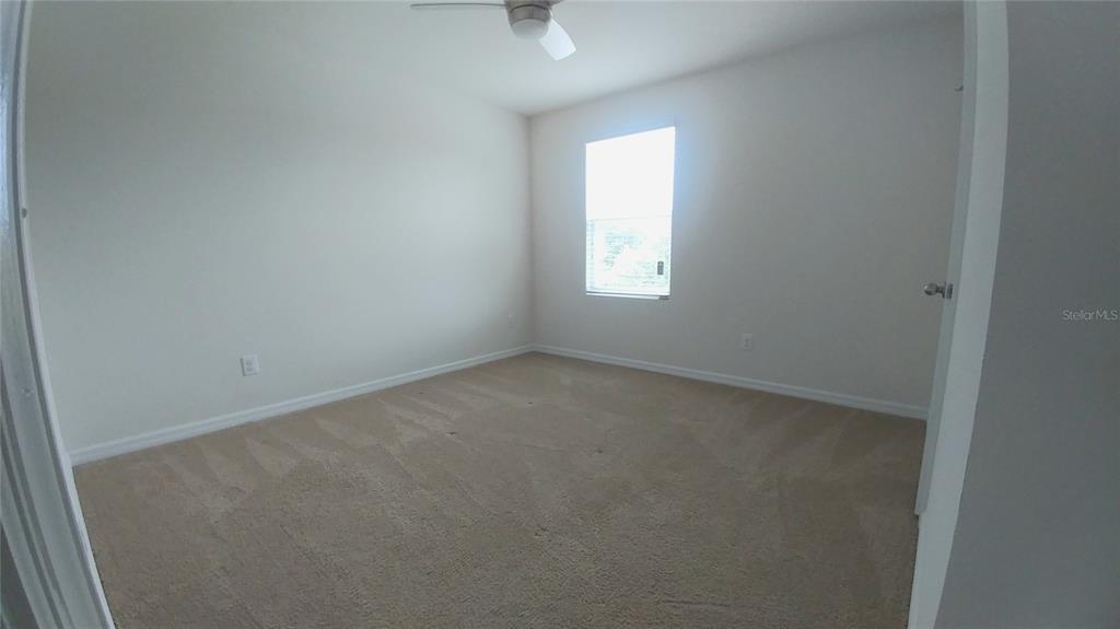 3936 Bramblewood Loop Spring Hill, FL 34609 - Photo 11 of 30 an empty room with a window