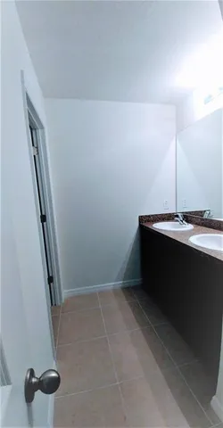 a bathroom with a toilet a sink and bathtub