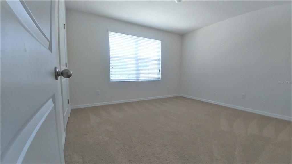 3936 Bramblewood Loop Spring Hill, FL 34609 - Photo 17 of 30 an empty room with a window