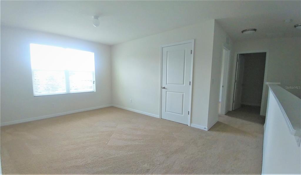 3936 Bramblewood Loop Spring Hill, FL 34609 - Photo 18 of 30 an empty room with a window