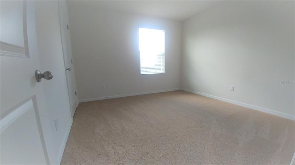 3936 Bramblewood Loop Spring Hill, FL 34609 - Photo 19 of 30 a view of an empty room with a window