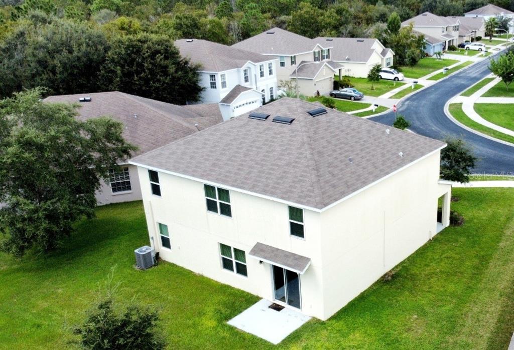 3936 Bramblewood Loop Spring Hill, FL 34609 - Photo 2 of 30 a aerial view of a house with a yard and sitting area