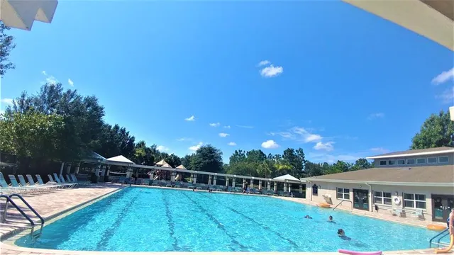 a view of a chairs and tables in a patio