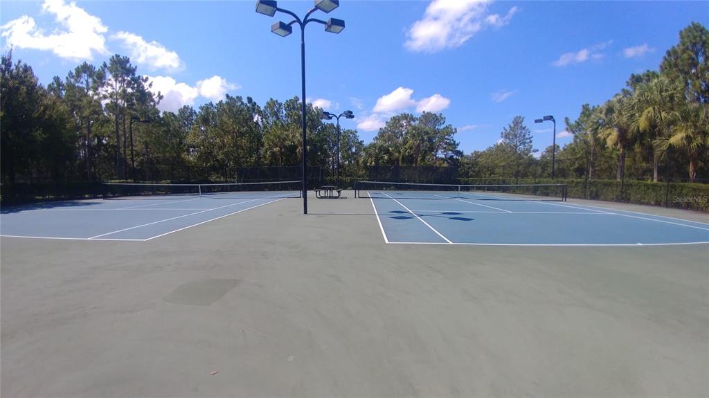 3936 Bramblewood Loop Spring Hill, FL 34609 - Photo 25 of 30 a view of a tennis court