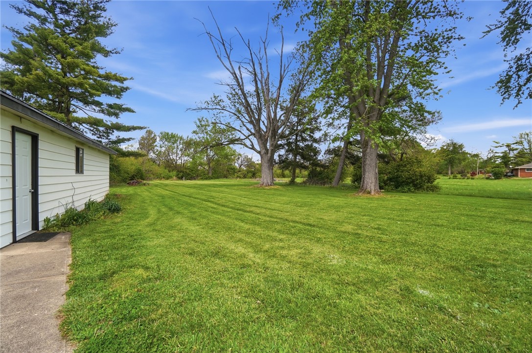 3991 Benner Road Miamisburg, OH 45342 - Photo 36 of 44 Expansive green yard with mature trees offers peaceful outdoor enjoyment.