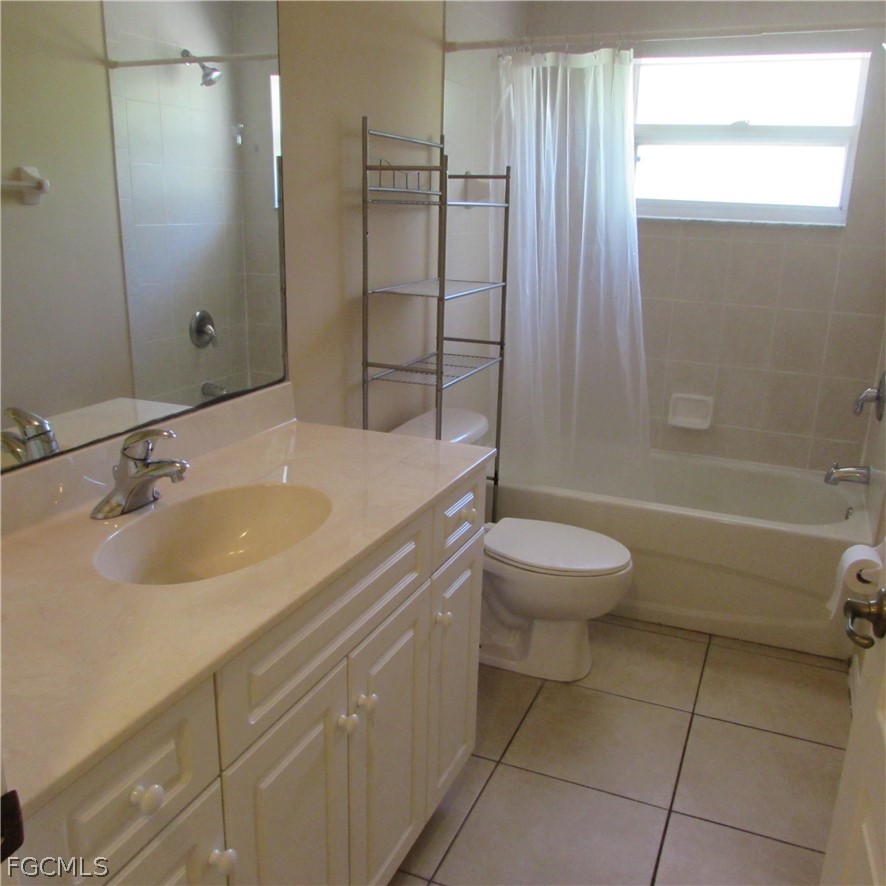 5773 Marina Road Bokeelia, FL 33922 - Photo 16 of 27 a bathroom with a sink toilet vanity and shower