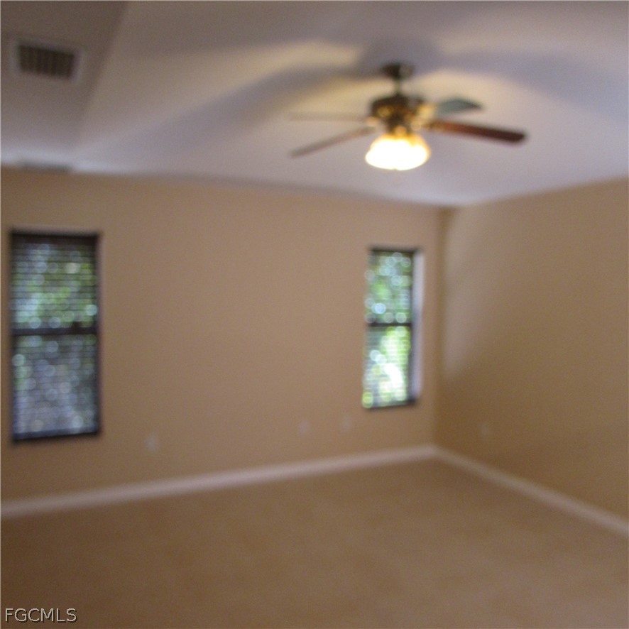 5773 Marina Road Bokeelia, FL 33922 - Photo 17 of 27 en empty room with a window