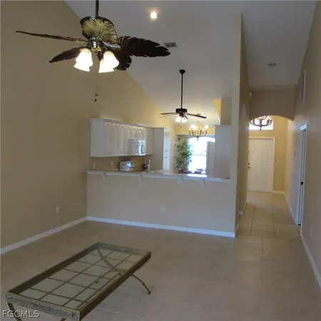a view of a room with a ceiling fan