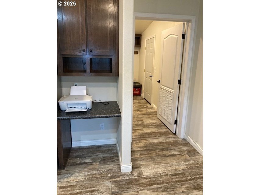 3075 Southwest River View Drive Pendleton, OR 97801 - Photo 13 of 34 a view of a hallway with wooden floor