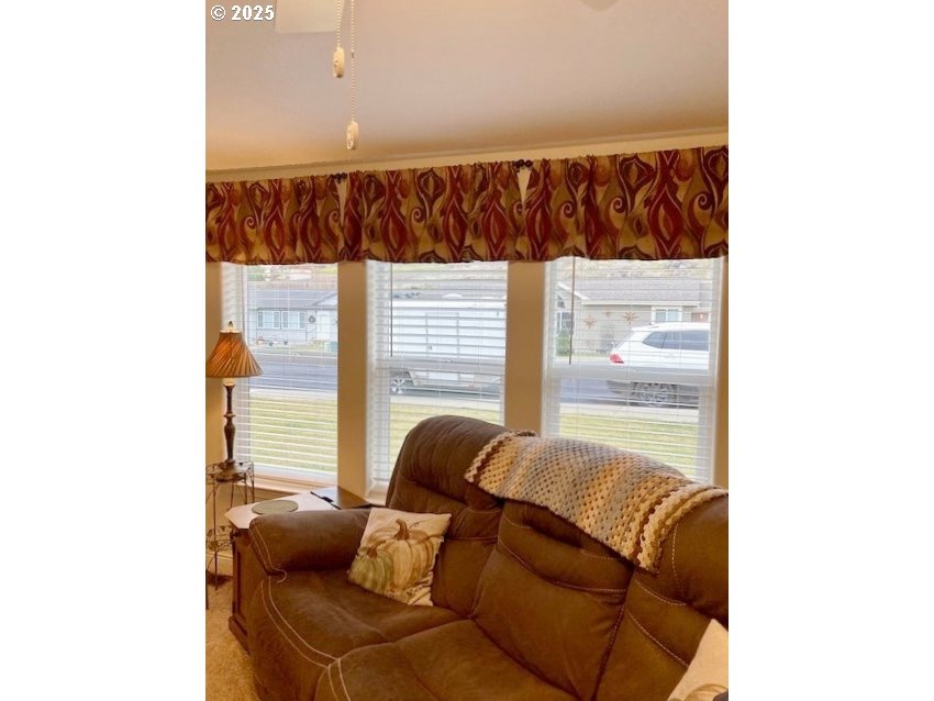 3075 Southwest River View Drive Pendleton, OR 97801 - Photo 5 of 34 a view of a living room with a couch and a window