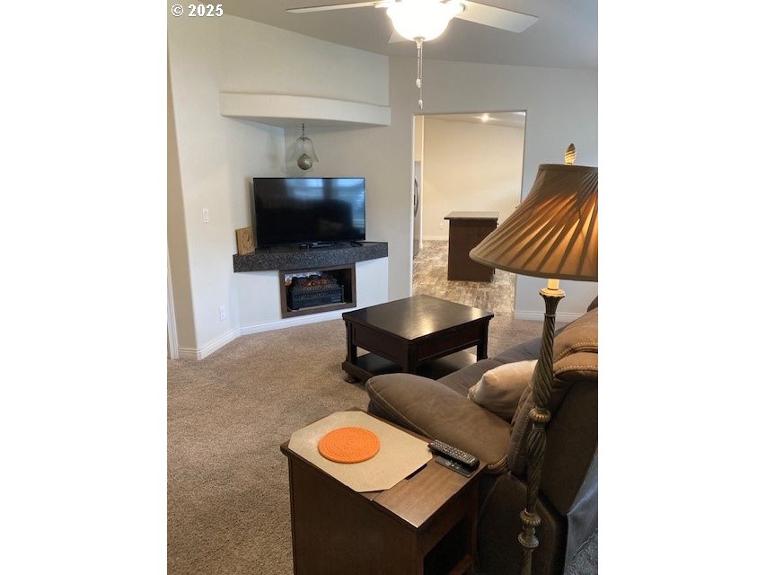 3075 Southwest River View Drive Pendleton, OR 97801 - Photo 6 of 34 a living room with furniture and a flat screen tv