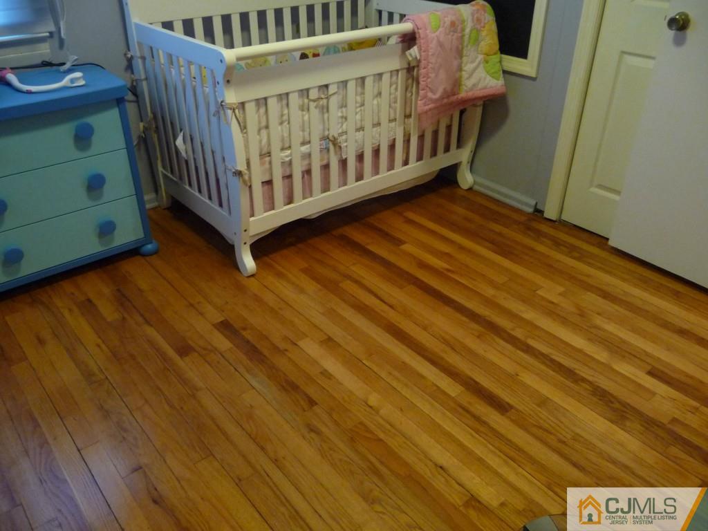 159 East Hill Road Colonia, NJ 07067 - Photo 11 of 21 a bedroom with furniture and a baby crib