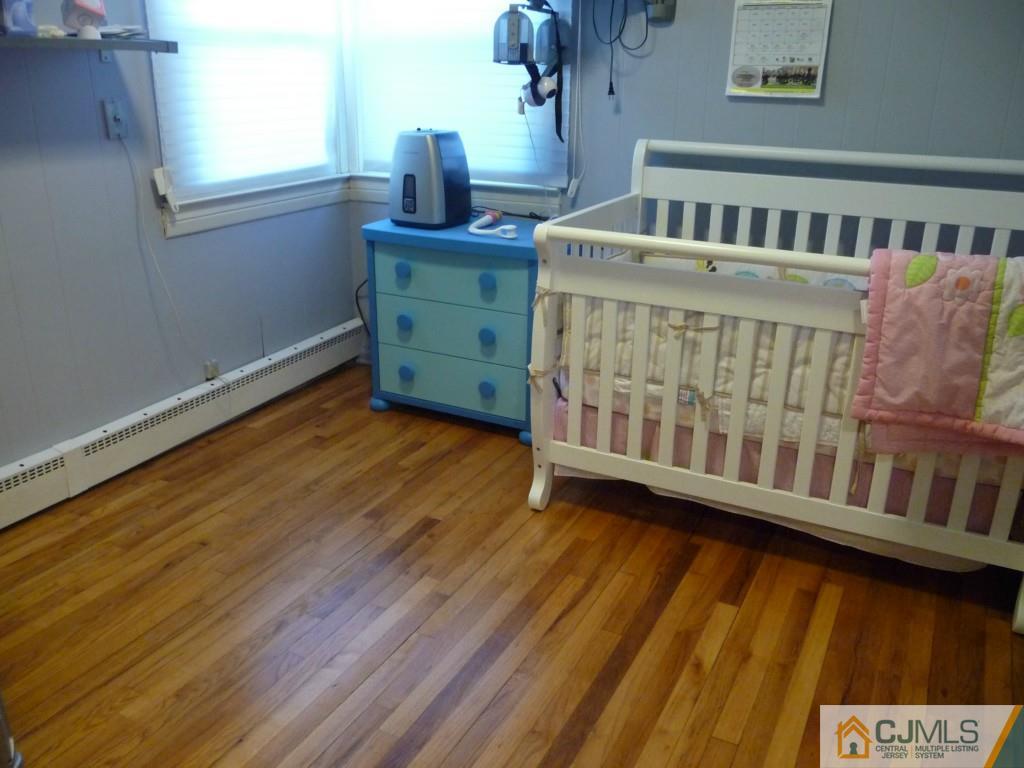 159 East Hill Road Colonia, NJ 07067 - Photo 12 of 21 a bedroom with furniture and a window