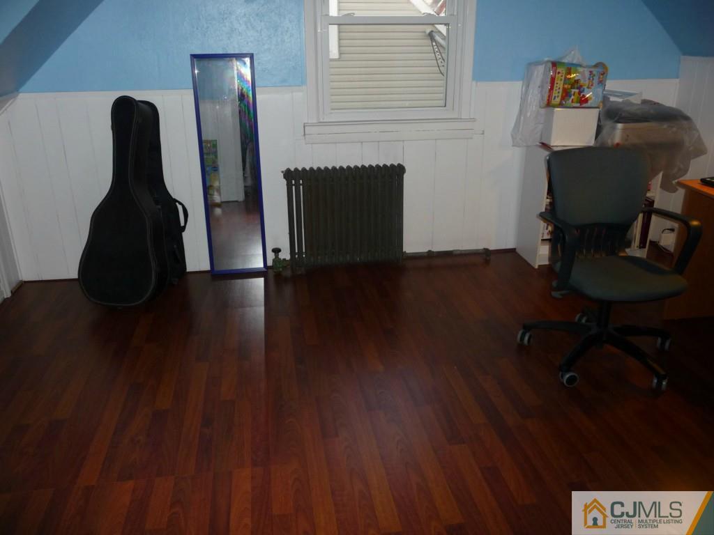 159 East Hill Road Colonia, NJ 07067 - Photo 15 of 21 a room with furniture and wooden floor