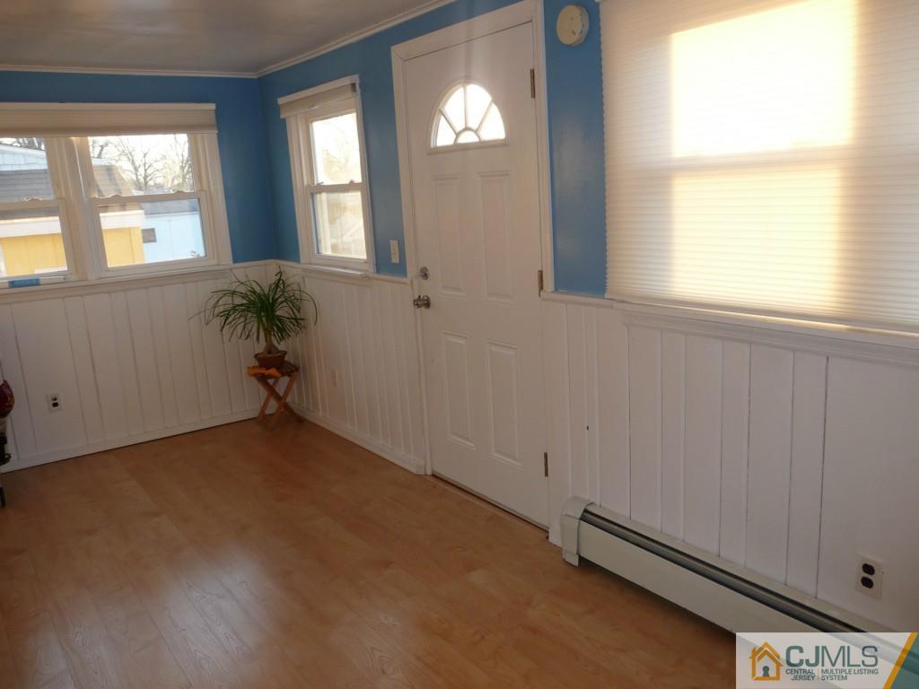 159 East Hill Road Colonia, NJ 07067 - Photo 5 of 21 an empty room with windows