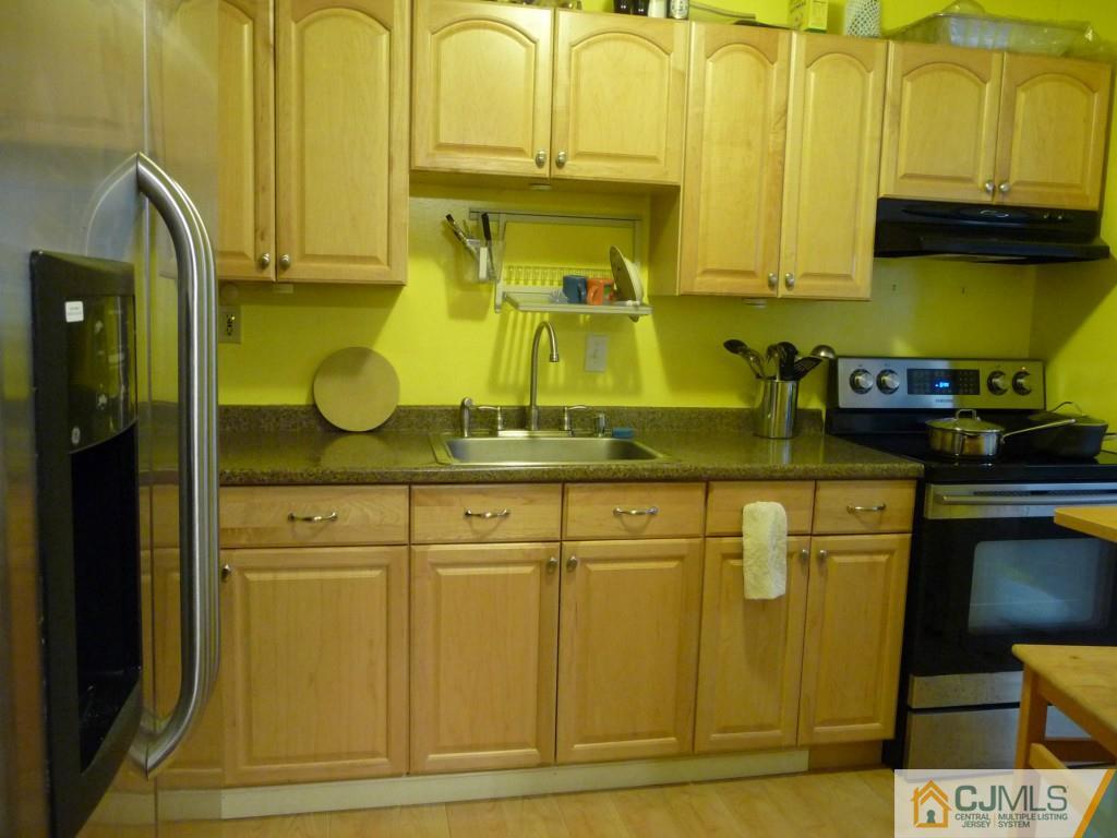 159 East Hill Road Colonia, NJ 07067 - Photo 8 of 21 a kitchen with a sink and cabinets