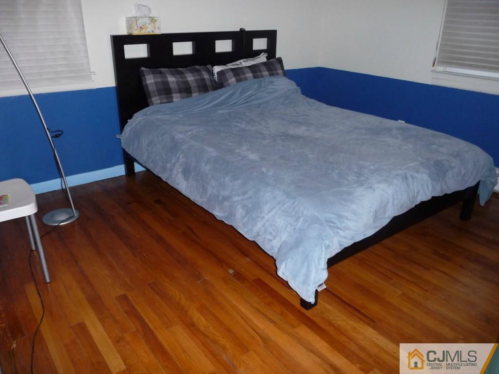 159 East Hill Road Colonia, NJ 07067 - Photo 9 of 21 a bedroom with a bed and dresser