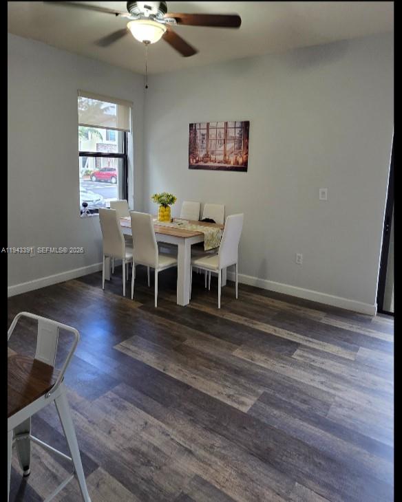 3203 Southeast 7th Street Homestead, FL 33033 - Photo 15 of 44 a view of a dining room with furniture window and wooden floor