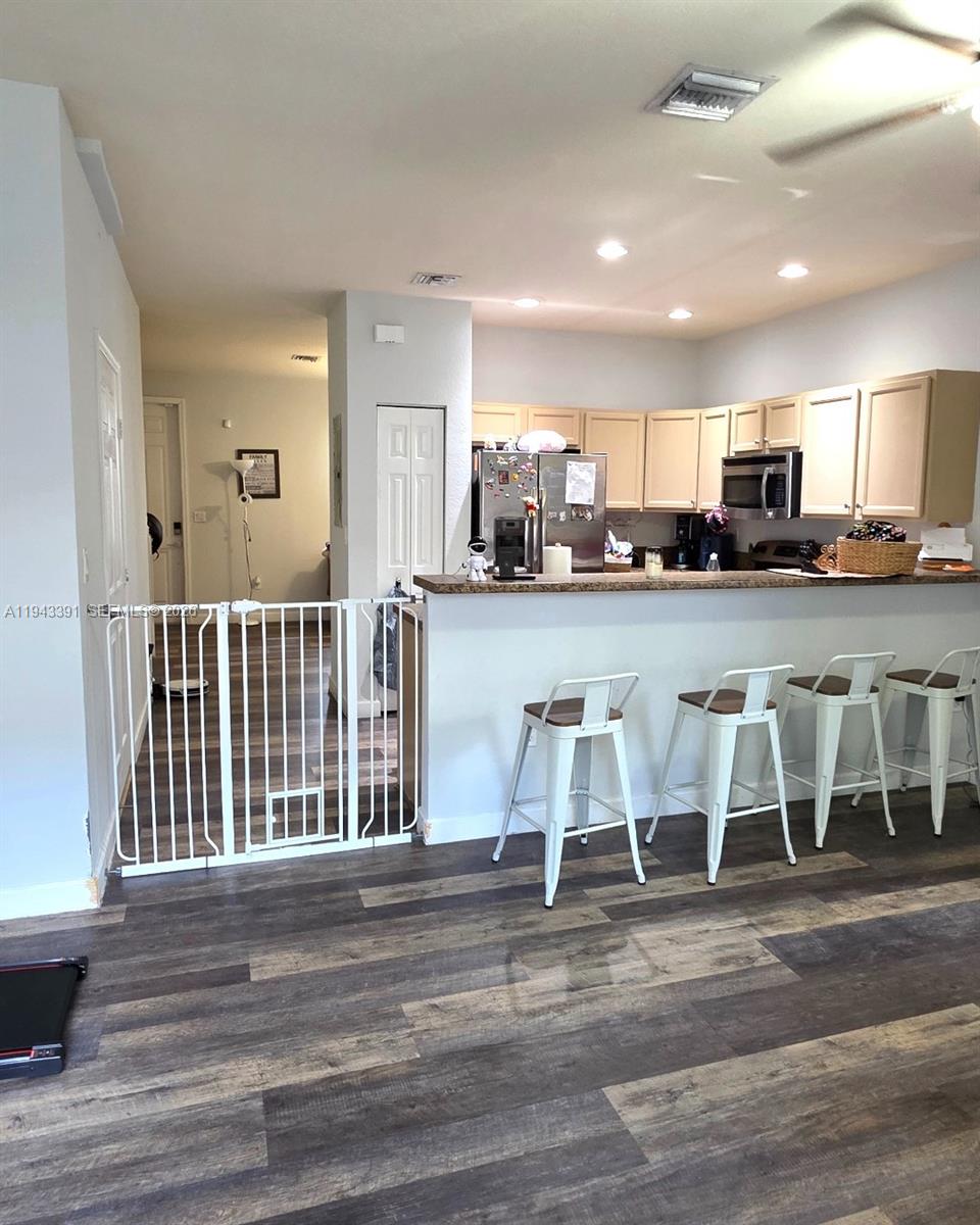 3203 Southeast 7th Street Homestead, FL 33033 - Photo 16 of 44 a view of kitchen and dining area with furniture