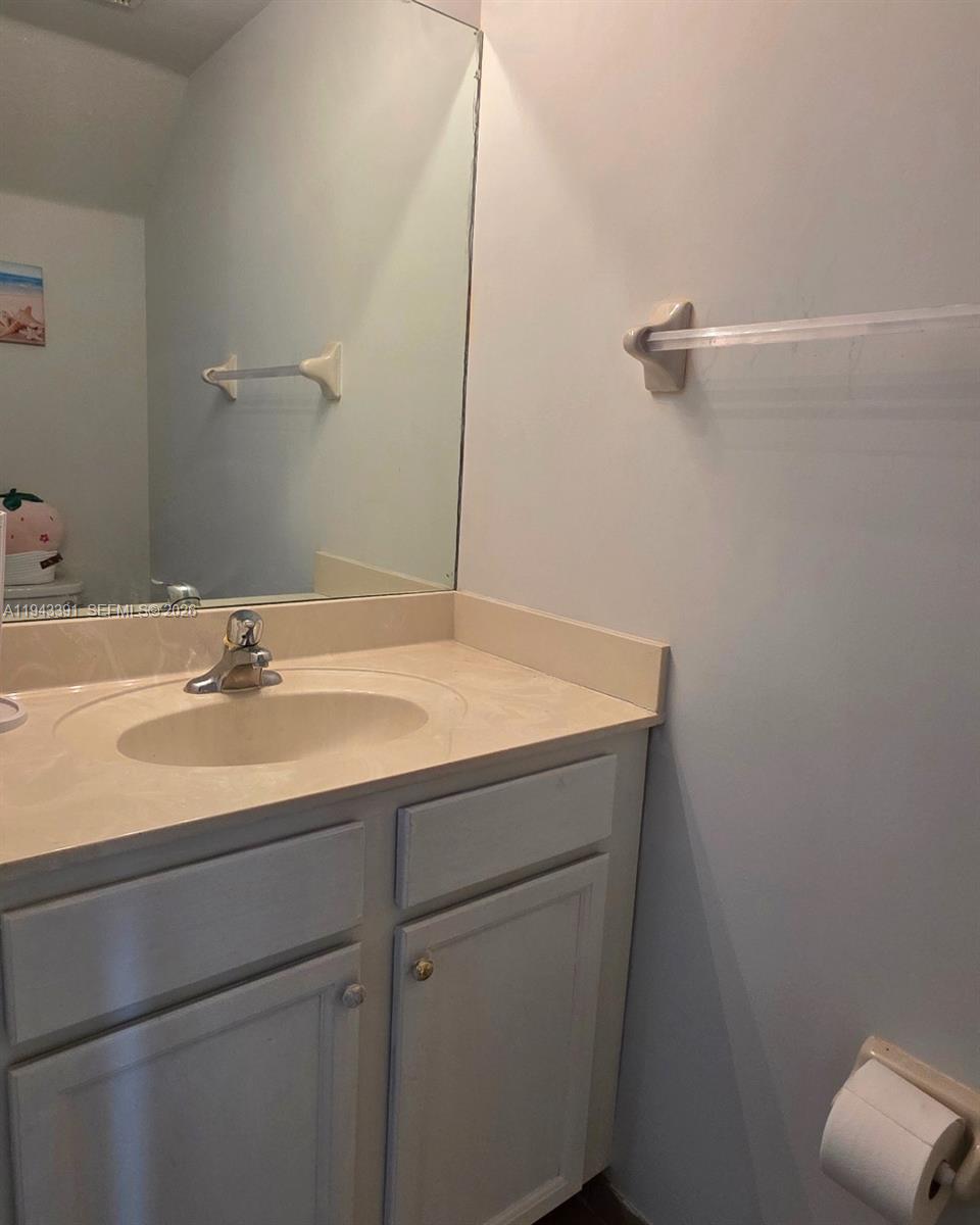 3203 Southeast 7th Street Homestead, FL 33033 - Photo 20 of 44 a bathroom with a sink and vanity