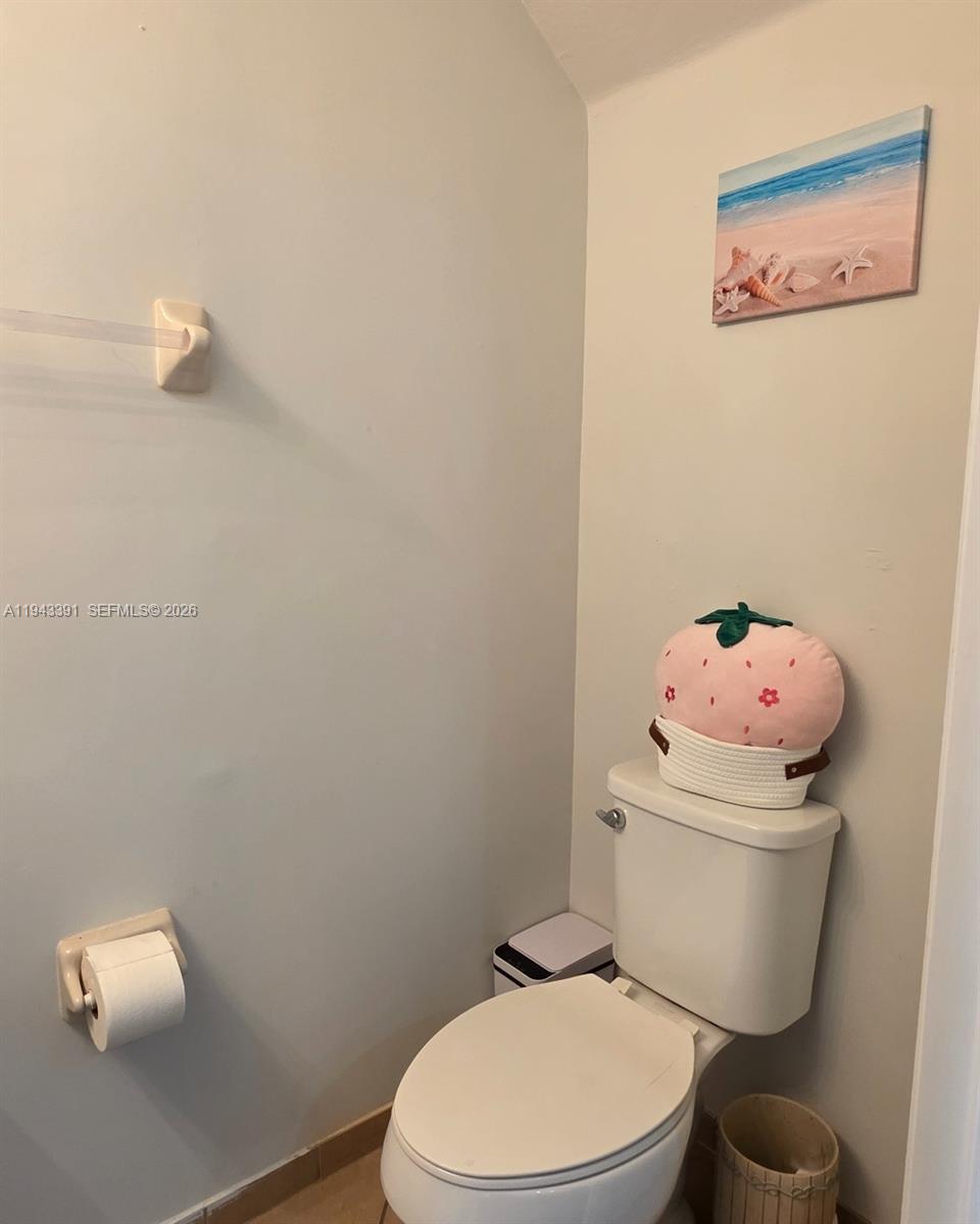 3203 Southeast 7th Street Homestead, FL 33033 - Photo 21 of 44 a white toilet sitting next to a small bathroom