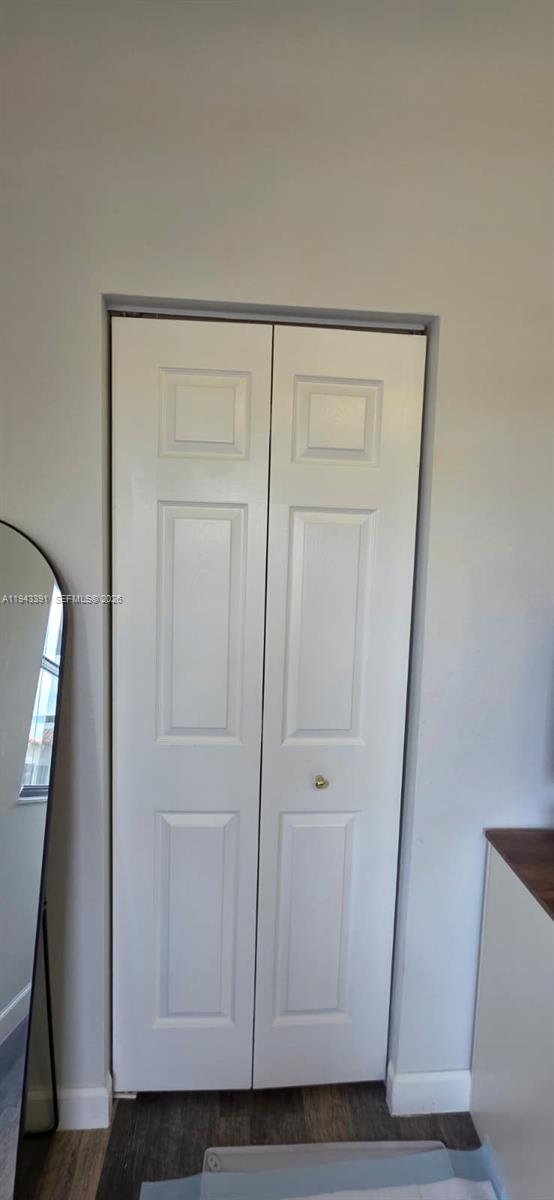 3203 Southeast 7th Street Homestead, FL 33033 - Photo 31 of 44 a view of a hallway with wooden floor
