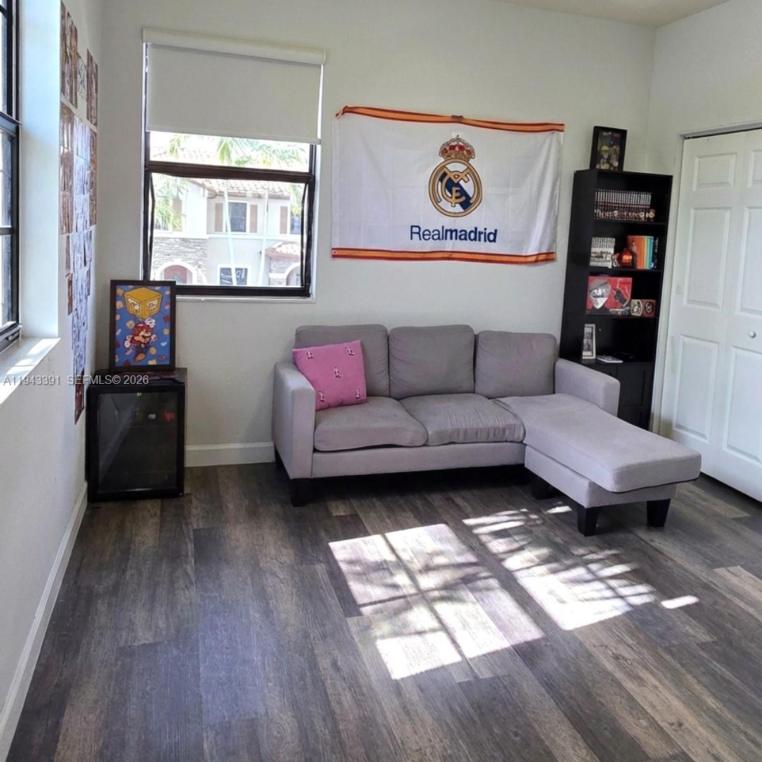 3203 Southeast 7th Street Homestead, FL 33033 - Photo 32 of 44 a living room with furniture and a window