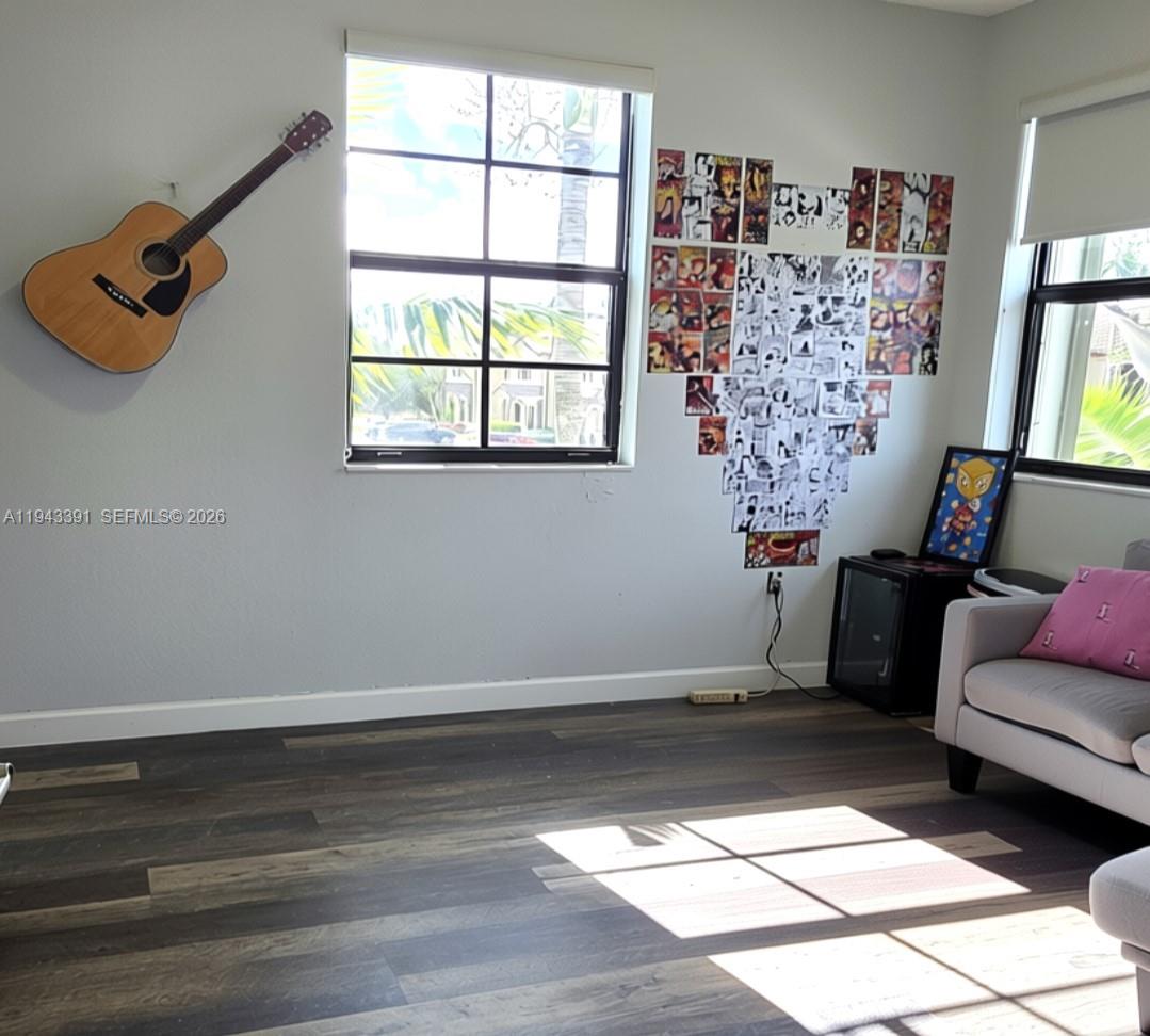3203 Southeast 7th Street Homestead, FL 33033 - Photo 33 of 44 a living room with furniture and a window