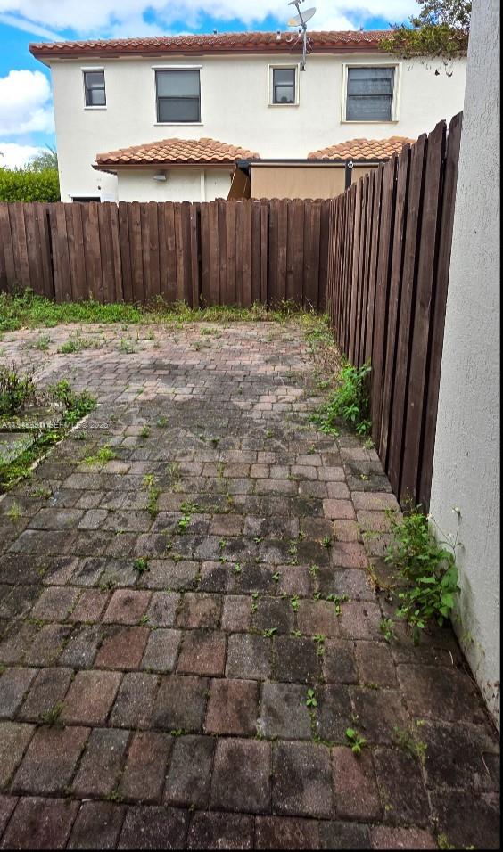 3203 Southeast 7th Street Homestead, FL 33033 - Photo 37 of 44 a view of a backyard with wooden fence