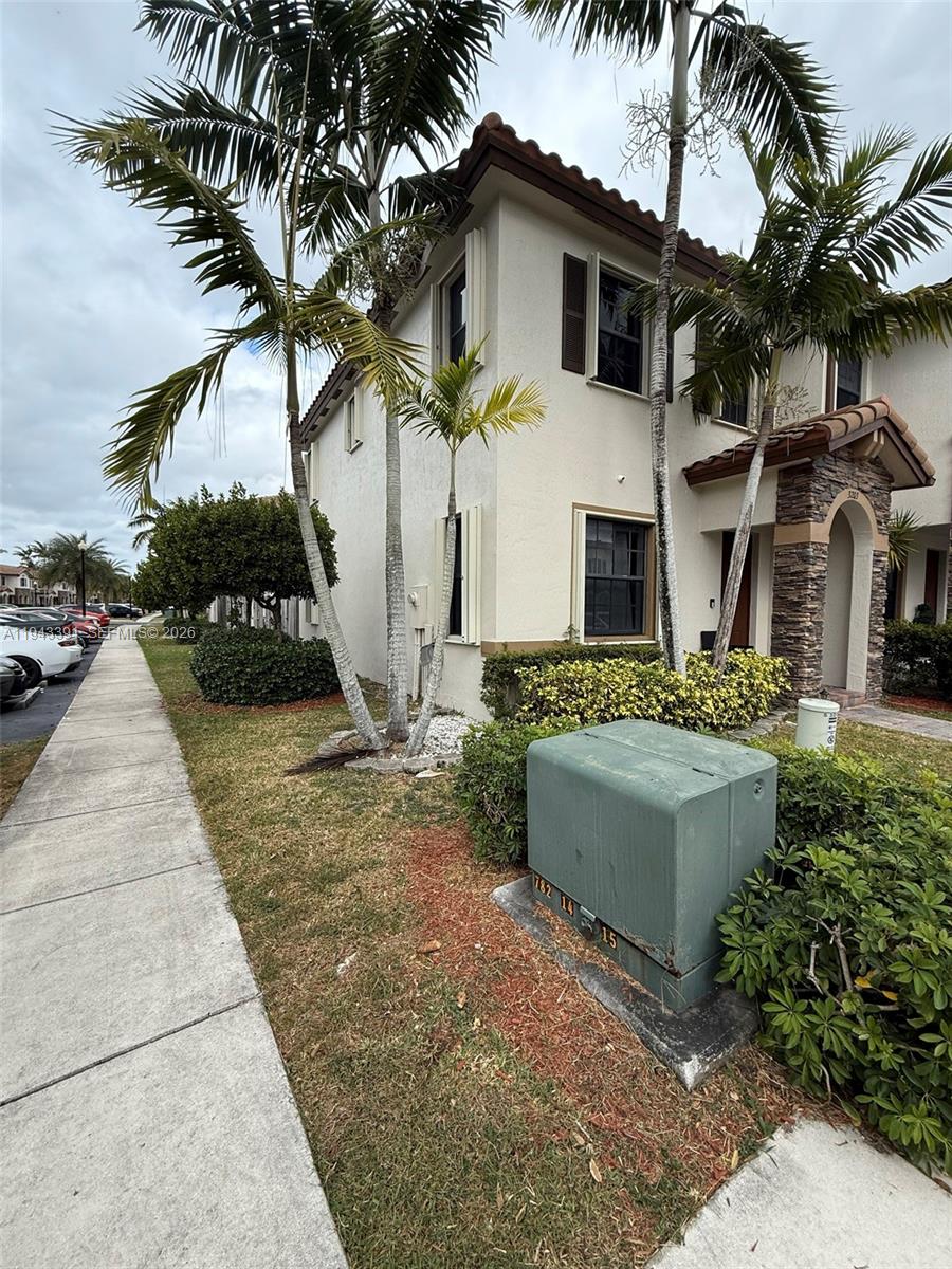 3203 Southeast 7th Street Homestead, FL 33033 - Photo 4 of 44 a front view of a house with a yard