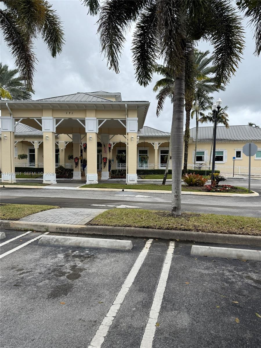 3203 Southeast 7th Street Homestead, FL 33033 - Photo 41 of 44 a front view of a building with a garden