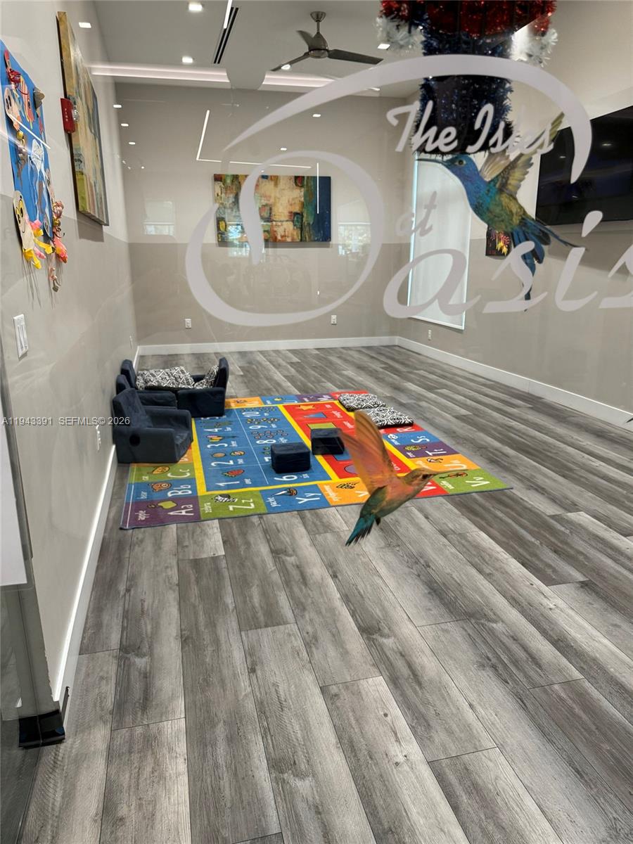 3203 Southeast 7th Street Homestead, FL 33033 - Photo 42 of 44 a room with toys and wooden floor