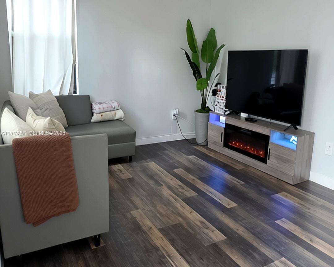 3203 Southeast 7th Street Homestead, FL 33033 - Photo 6 of 44 a living room with furniture and a flat screen tv