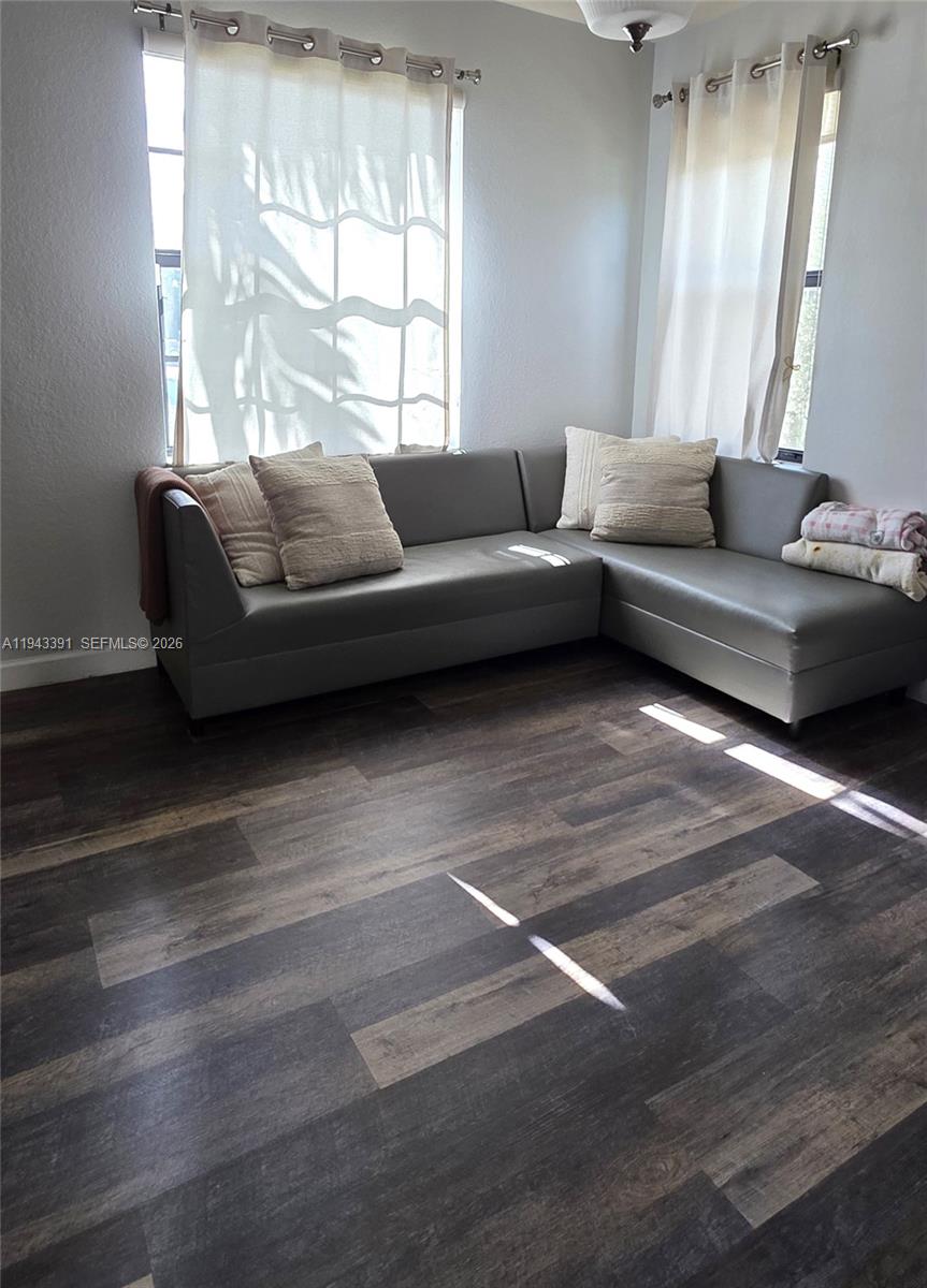 3203 Southeast 7th Street Homestead, FL 33033 - Photo 7 of 44 a living room with furniture and windows