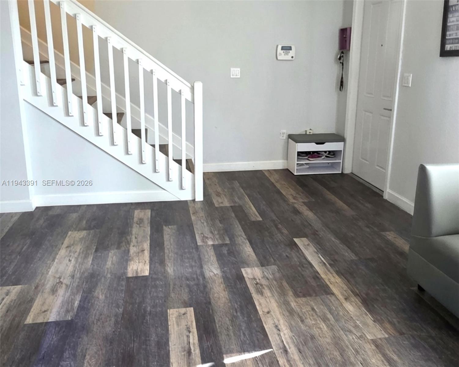3203 Southeast 7th Street Homestead, FL 33033 - Photo 9 of 44 a view of a hallway with wooden floor