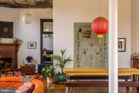 a room with furniture a window and a book shelf