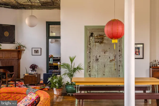 a room with furniture a window and a book shelf