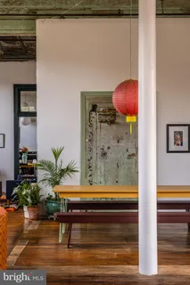 a living room with lots of furniture and a wooden floor