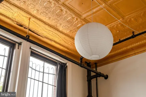 a view of a room with wooden furniture