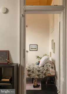 a view of a patio with table and chairs under an umbrella