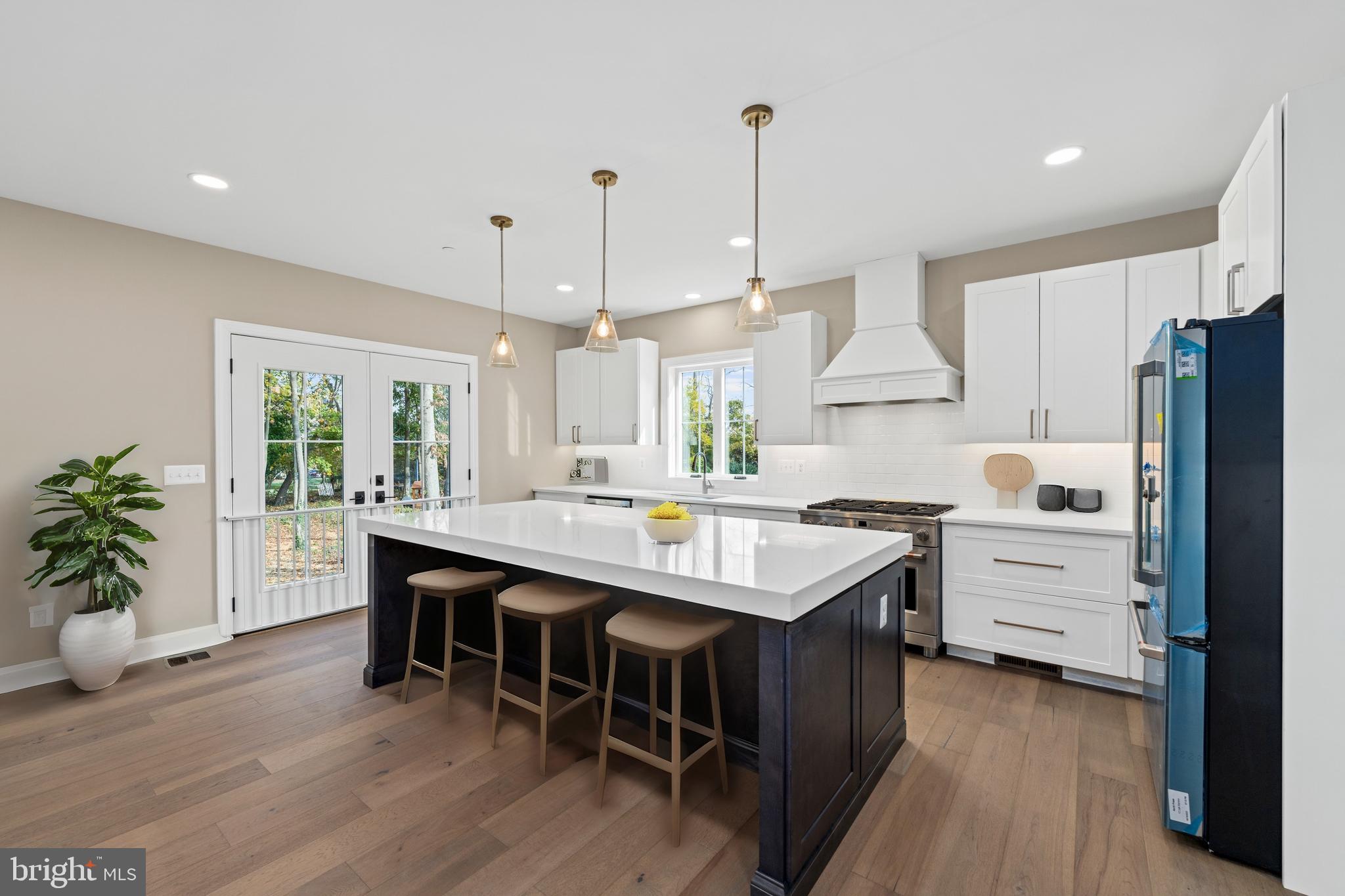Stem Rd Union Bridge Union Bridge, MD 21791 - Photo 15 of 72 a kitchen with white cabinets and wooden floors