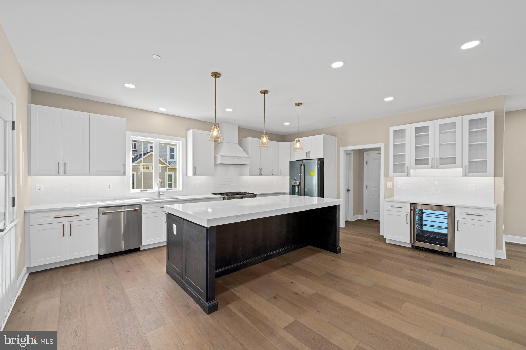 Stem Rd Union Bridge Union Bridge, MD 21791 - Photo 18 of 72 a large kitchen with granite countertop a stove top oven a sink dishwasher and a fireplace with wooden floor