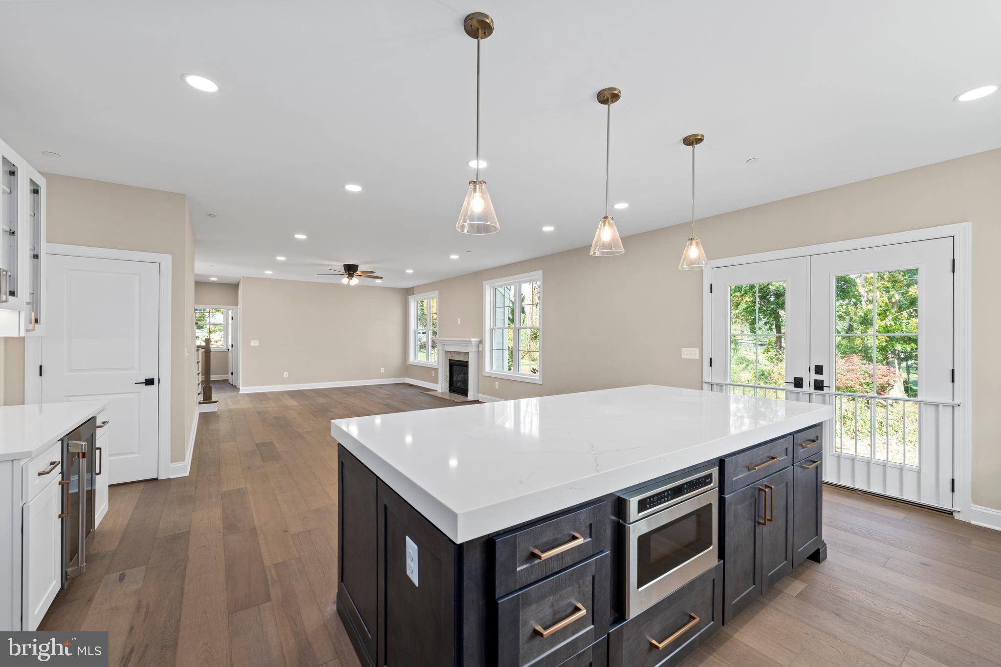 Stem Rd Union Bridge Union Bridge, MD 21791 - Photo 19 of 72 a open kitchen with stainless steel appliances granite countertop a refrigerator a oven and a wooden floors