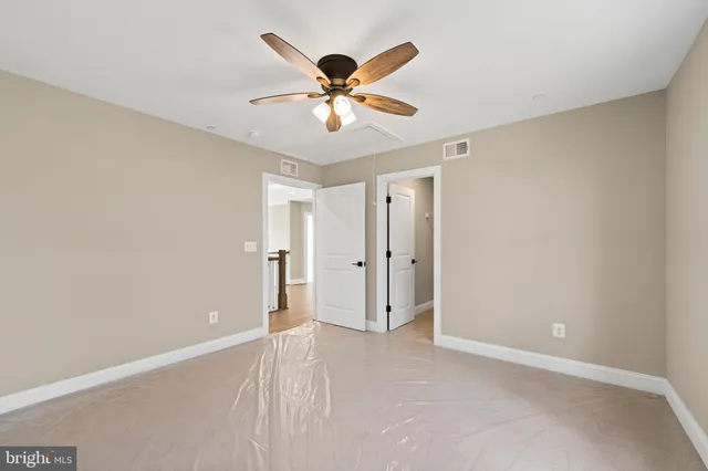 an aerial view of a house with a yard and plants
