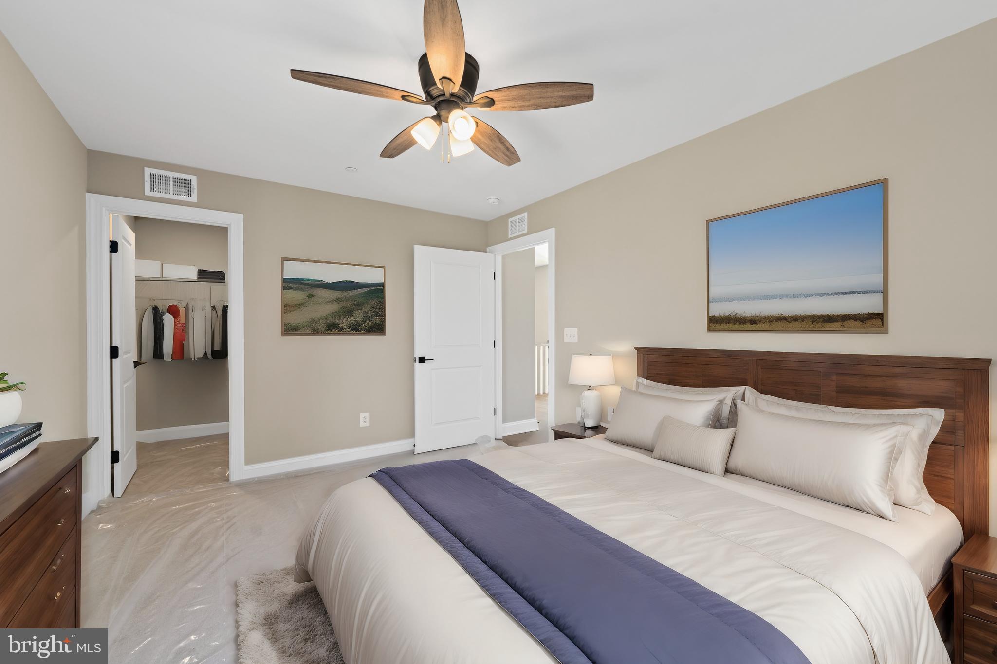 Stem Rd Union Bridge Union Bridge, MD 21791 - Photo 36 of 72 a bedroom with a large bed and a chandelier