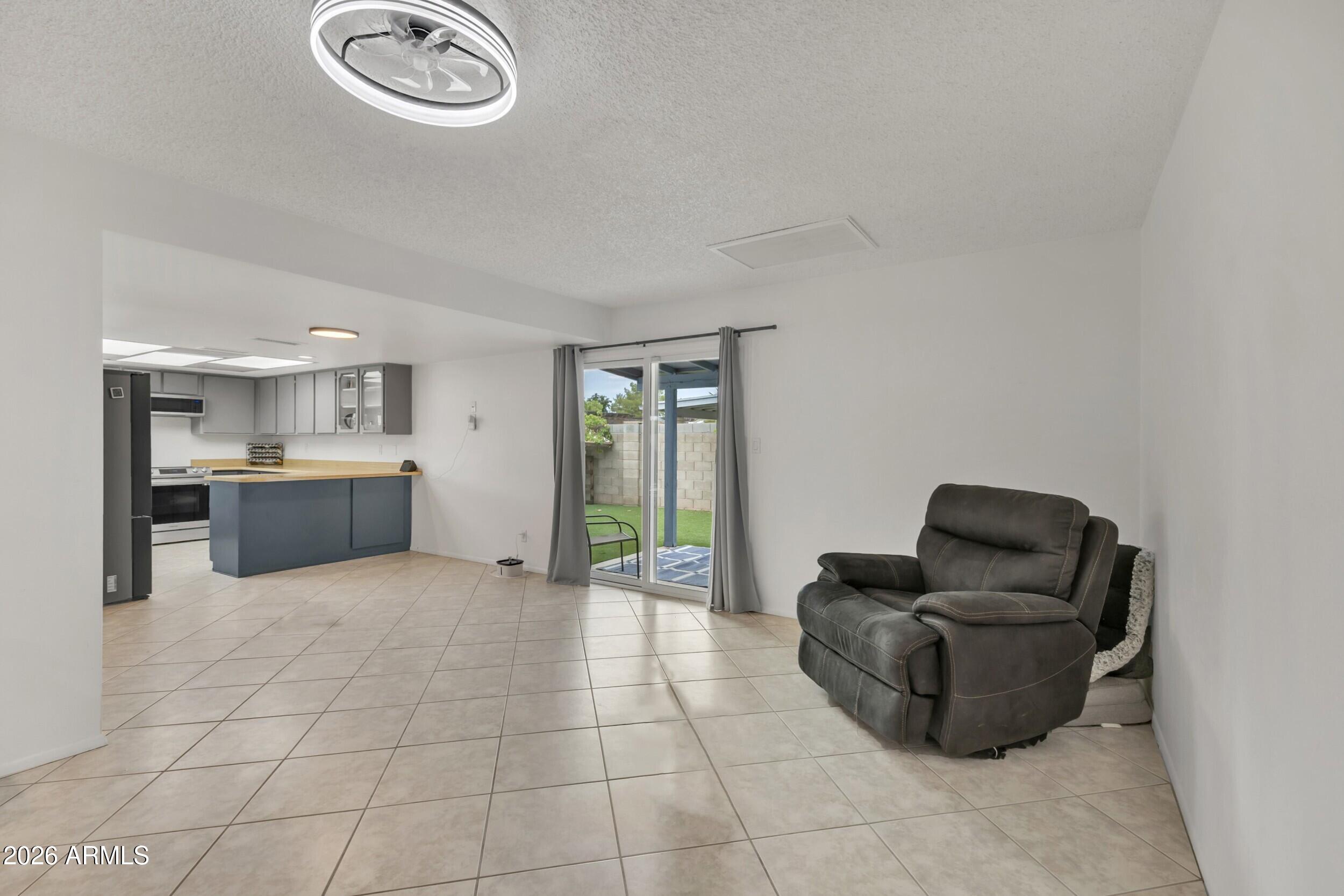 3833 West Phelps Road Phoenix, AZ 85053 - Photo 29 of 55 Family room & breakfast nook