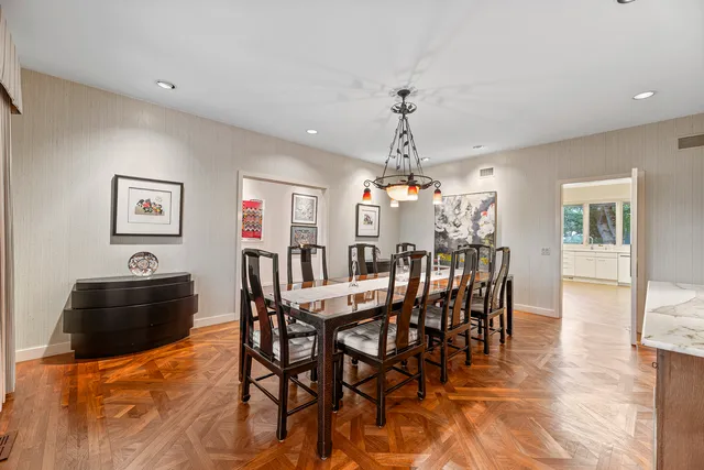 a large white kitchen with cabinets